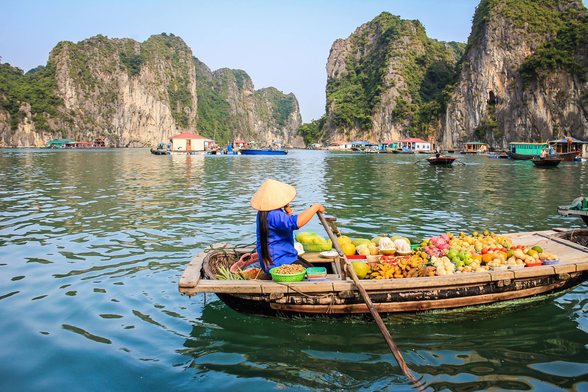 Fruit seller in a boat , Halong Bay Vietnam