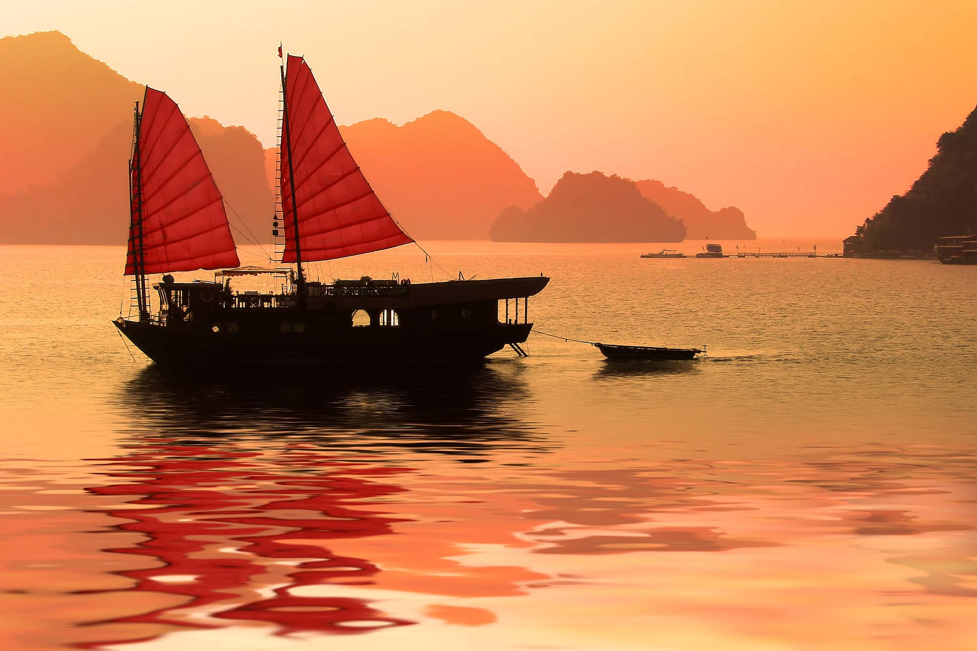 Junk boat at sunset in Halong Bay, Vietnam
